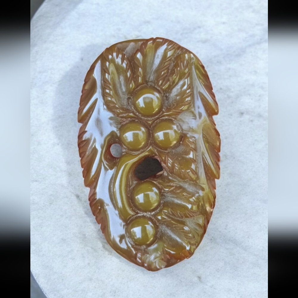 Vintage Art Deco deeply carved green Bakelite dress clip